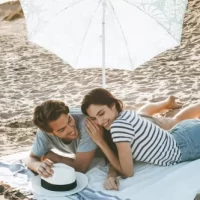 AnyConv.com__young-couple-lying-beach (1)